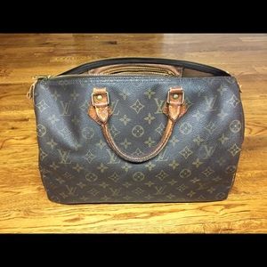 Louis Vuitton Speedy 30 bag in worn condition.